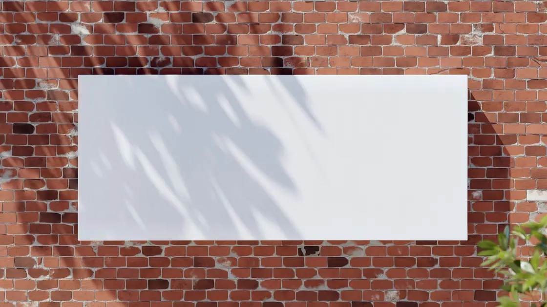 Blank white banner mounted on a red brick wall