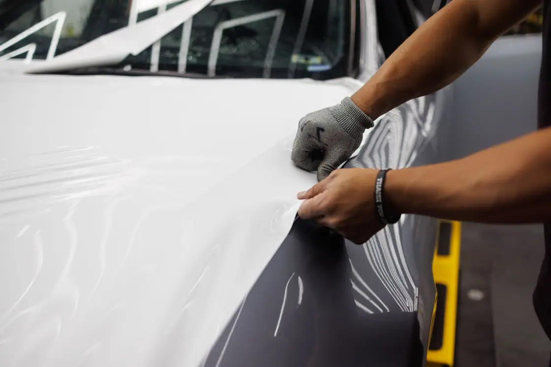 Stretching vinyl over a hood edge photograph